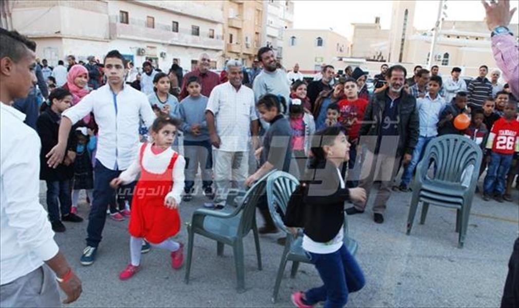 بالصور: أطفال السلماني يتحدون أصوات الرصاص بحفل ترفيهي