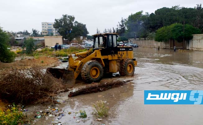 Rainwater floods the streets in Janzour