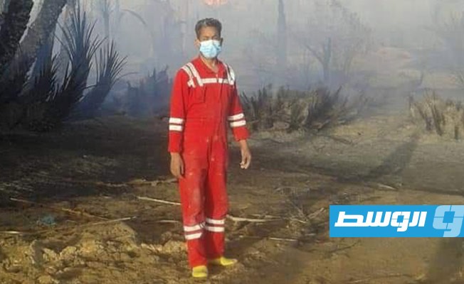 إخماد حريق في مزارع النخيل بمرادة، 13 فبراير 2021. (هيئة السلامة الوطنية طرابلس)