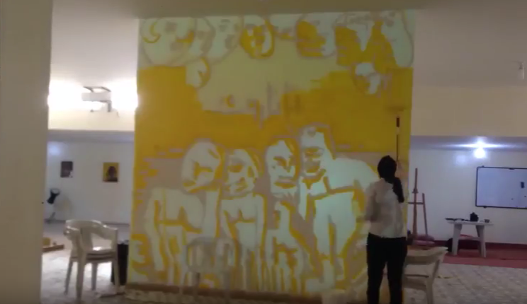 بالفيديو: «شفاء البرعصي» تصمم جدارية بعنوان «الليبيون»