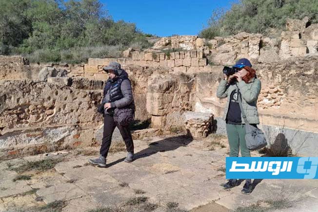 Tourists from Russia, China, and Ireland visit the ancient city of Leptis Magna