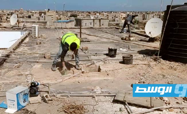 من أعمال الصيانة الشاملة لعمارات حي المساكن بمدينة بنغازي، 18 مارس 2023. (بلدية بنغازي)