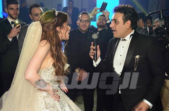 بالصور: نجوم الفن في حفل زفاف محمد رحيم ومدربة الأسود