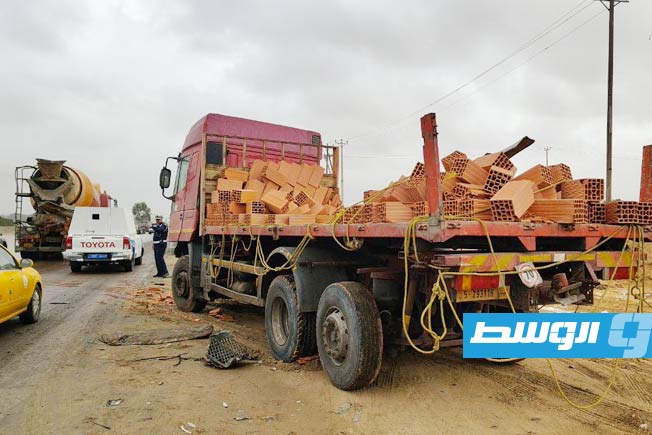 Truck loaded with clay bricks skids off Tripoli's Airport Road