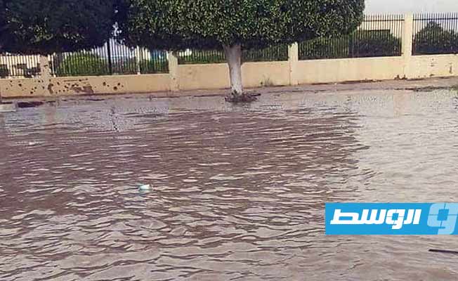 Rainwater floods the streets of Sirte
