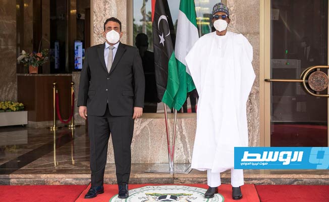 رئيس المجلس الرئاسي محمد المنفي مع نظيره النيجيري محمد بخاري خلال لقاء، 26 مايو 2021. (المجلس الرئاسي)