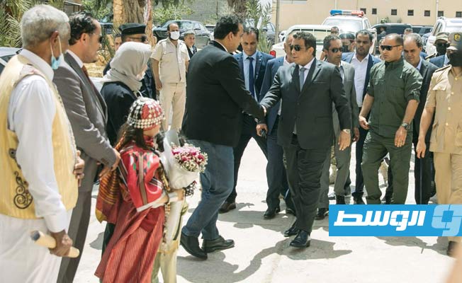 رئيس المجلس الرئاسي محمد المنفي، في زيارة لمدينة درنة, 1 مايو 2021. (المكتب الإعلامي للمجلس الرئاسي)
